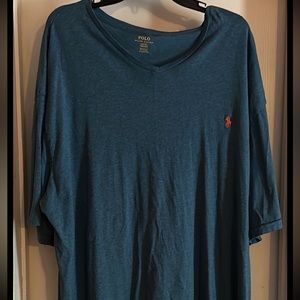 Men’s blue polo with orange pony